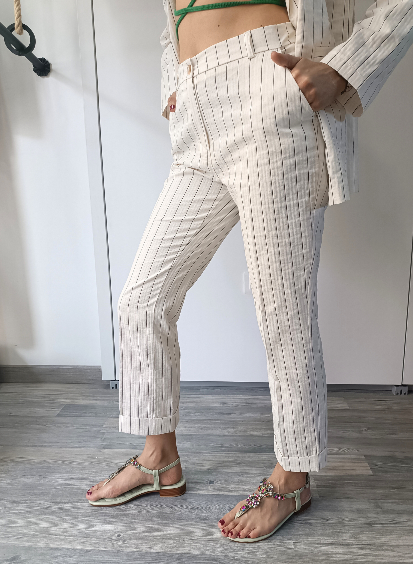 Pantaloni gessati fondo panna