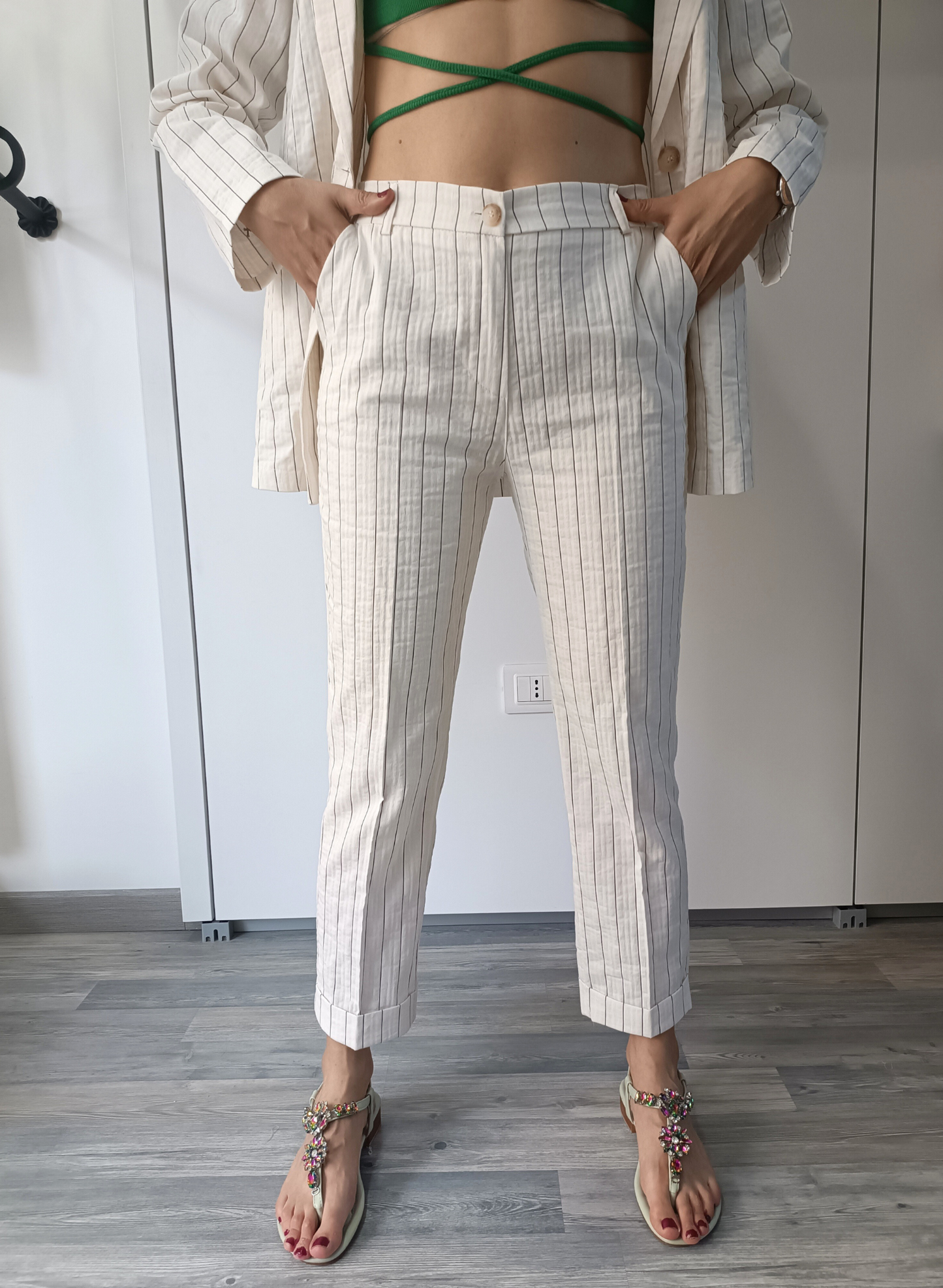 Pantaloni gessati fondo panna